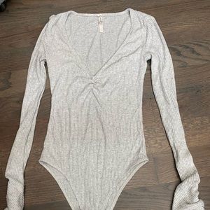 Grey long sleeved free people bodysuit